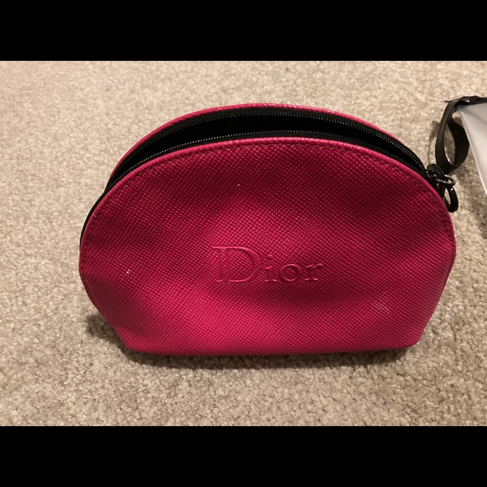 Dior hot pink beauty bag.